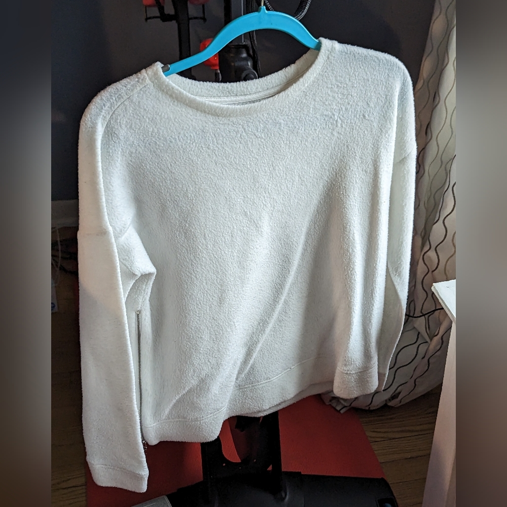 Oversized white sweater with side zipper detailing